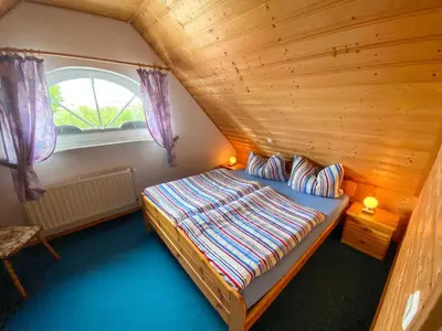 Ein Bett oder Betten in einem Zimmer der Unterkunft Ferienhaus Boddenurlaub