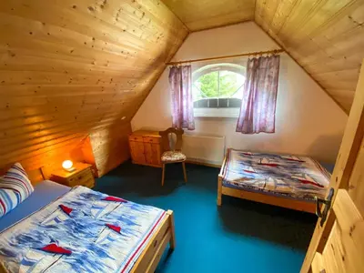 Ein Bett oder Betten in einem Zimmer der Unterkunft Ferienhaus Boddenurlaub