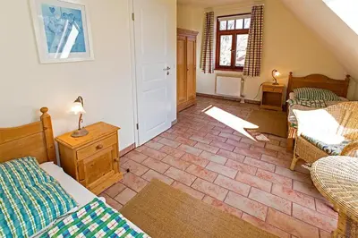Ein Bett oder Betten in einem Zimmer der Unterkunft Ferienhaussiedlung Strandperlen Buchenhof 1a (Haustyp IV)