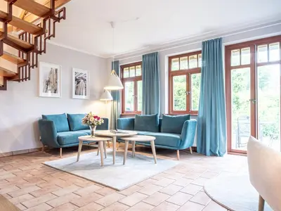 Ein Sitzbereich in der Unterkunft Ferienhaussiedlung Strandperlen Buchenhof 1a (Haustyp IV)