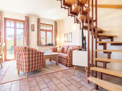 Ein Sitzbereich in der Unterkunft Ferienhaussiedlung Strandperlen Buchenhof 3b (Typ III)