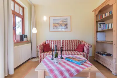 Ein Sitzbereich in der Unterkunft Ferienhaussiedlung Strandperlen Buchenhof 4d (Typ IV)