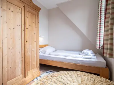 Ein Bett oder Betten in einem Zimmer der Unterkunft Ferienhaussiedlung Strandperlen Buchenhof 1b (Haustyp VI)