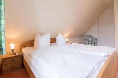 Ein Bett oder Betten in einem Zimmer der Unterkunft Ferienhaussiedlung Strandperlen Buchenhof 6b (Typ III)