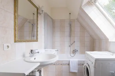 Ein Badezimmer in der Unterkunft Ferienhaussiedlung Strandperlen Buchenhof 6b (Typ III)