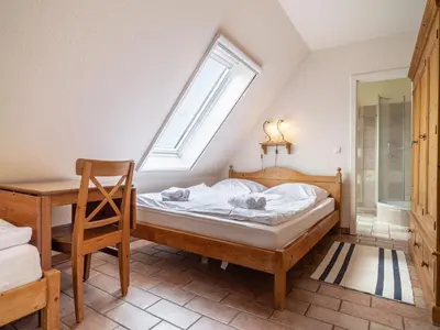 Ein Bett oder Betten in einem Zimmer der Unterkunft Ferienhaussiedlung Strandperlen Buchenhof 1d (Haustyp I)