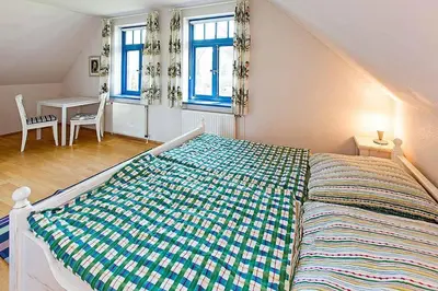 Ein Bett oder Betten in einem Zimmer der Unterkunft Ferienhaussiedlung Strandperlen Weidenhof 5b (Typ VII)