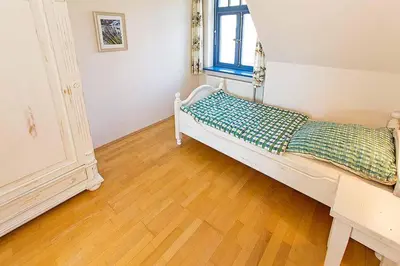 Ein Bett oder Betten in einem Zimmer der Unterkunft Ferienhaussiedlung Strandperlen Weidenhof 5b (Typ VII)
