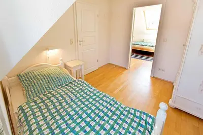Ein Bett oder Betten in einem Zimmer der Unterkunft Ferienhaussiedlung Strandperlen Weidenhof 5b (Typ VII)