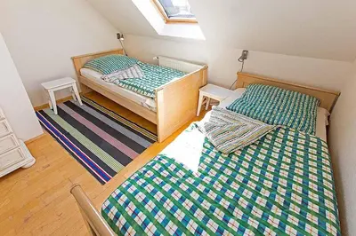 Ein Bett oder Betten in einem Zimmer der Unterkunft Ferienhaussiedlung Strandperlen Weidenhof 5b (Typ VII)