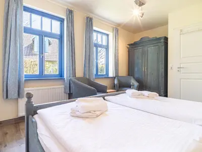 Ein Bett oder Betten in einem Zimmer der Unterkunft Ferienhaussiedlung Strandperlen Weidenhof 6b (Typ IX)
