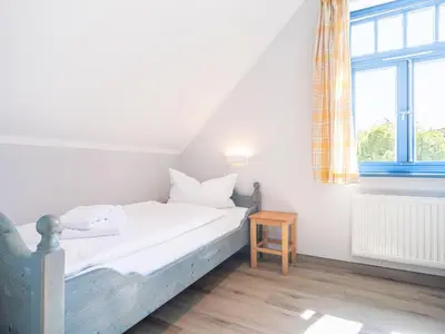 Ein Bett oder Betten in einem Zimmer der Unterkunft Ferienhaussiedlung Strandperlen Weidenhof 6b (Typ IX)