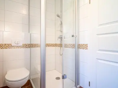 Ein Badezimmer in der Unterkunft Ferienhaussiedlung Strandperlen Weidenhof 6b (Typ IX)