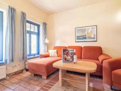 Ein Sitzbereich in der Unterkunft Ferienhaussiedlung Strandperlen Weidenhof 6b (Typ IX)