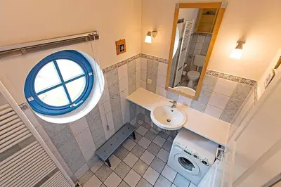 Ein Badezimmer in der Unterkunft Ferienhaussiedlung Strandperlen Weidenhof 7a (Typ VII)
