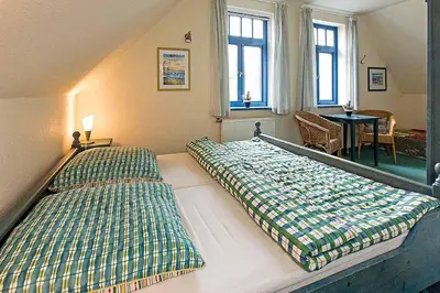 Ein Bett oder Betten in einem Zimmer der Unterkunft Ferienhaussiedlung Strandperlen Weidenhof 7a (Typ VII)