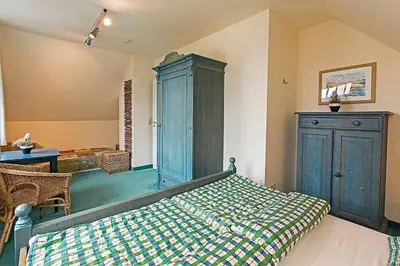 Ein Bett oder Betten in einem Zimmer der Unterkunft Ferienhaussiedlung Strandperlen Weidenhof 7a (Typ VII)