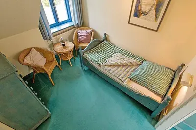 Ein Bett oder Betten in einem Zimmer der Unterkunft Ferienhaussiedlung Strandperlen Weidenhof 7a (Typ VII)