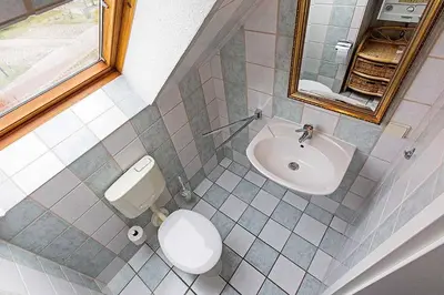 Ein Badezimmer in der Unterkunft Ferienhaussiedlung Strandperlen Weidenhof 7a (Typ VII)