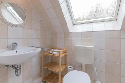 Ein Badezimmer in der Unterkunft Ferienhaussiedlung Strandperlen Weidenhof 7b (Typ VII)