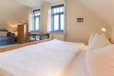 Ein Bett oder Betten in einem Zimmer der Unterkunft Ferienhaussiedlung Strandperlen Weidenhof 7b (Typ VII)