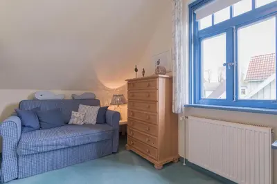 Ein Sitzbereich in der Unterkunft Ferienhaussiedlung Strandperlen Weidenhof 7b (Typ VII)
