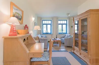 Ein Sitzbereich in der Unterkunft Ferienhaussiedlung Strandperlen Weidenhof 7b (Typ VII)