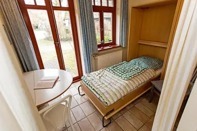 Ein Bett oder Betten in einem Zimmer der Unterkunft Ferienhaussiedlung Strandperlen Weidenhof 2a (Typ III)