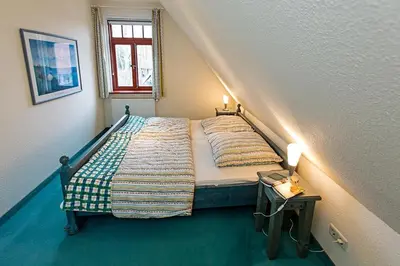 Ein Bett oder Betten in einem Zimmer der Unterkunft Ferienhaussiedlung Strandperlen Weidenhof 2a (Typ III)