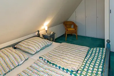 Ein Bett oder Betten in einem Zimmer der Unterkunft Ferienhaussiedlung Strandperlen Weidenhof 2a (Typ III)