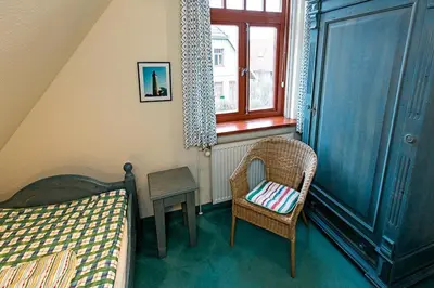 Ein Bett oder Betten in einem Zimmer der Unterkunft Ferienhaussiedlung Strandperlen Weidenhof 2a (Typ III)
