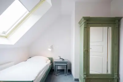 Ein Bett oder Betten in einem Zimmer der Unterkunft Ferienhaussiedlung Strandperlen Weidenhof 9a (Typ VII)