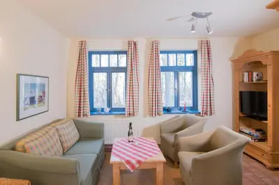 Ein Sitzbereich in der Unterkunft Ferienhaussiedlung Strandperlen Weidenhof 9b (Typ IX)