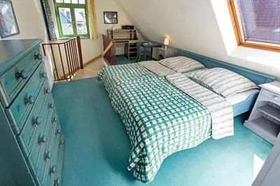 Ein Bett oder Betten in einem Zimmer der Unterkunft Ferienhaussiedlung Strandperlen Sanddornhof 3d (Typ I)