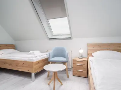 Ein Bett oder Betten in einem Zimmer der Unterkunft Ferienhaussiedlung Strandperlen Sanddornhof 4b (Typ IX)