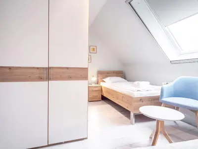 Ein Bett oder Betten in einem Zimmer der Unterkunft Ferienhaussiedlung Strandperlen Sanddornhof 4b (Typ IX)