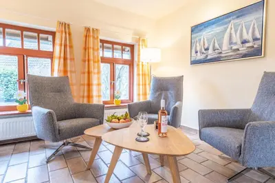 Ein Sitzbereich in der Unterkunft Ferienhaussiedlung Strandperlen Sanddornhof 4b (Typ IX)