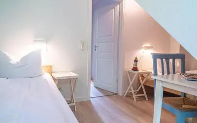Ein Bett oder Betten in einem Zimmer der Unterkunft Ferienhaussiedlung Strandperlen Sanddornhof 5b (Typ V)