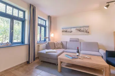 Ein Sitzbereich in der Unterkunft Ferienhaussiedlung Strandperlen Sanddornhof 6a (Typ VII)
