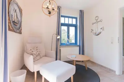 Ein Sitzbereich in der Unterkunft Ferienhaussiedlung Strandperlen Sanddornhof 6a (Typ VII)