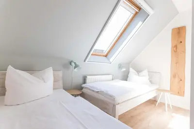 Ein Bett oder Betten in einem Zimmer der Unterkunft Ferienhaussiedlung Strandperlen Sanddornhof 6a (Typ VII)