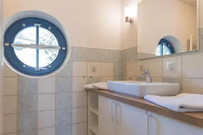 Ein Badezimmer in der Unterkunft Ferienhaussiedlung Strandperlen Sanddornhof 6a (Typ VII)