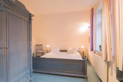 Ein Bett oder Betten in einem Zimmer der Unterkunft Ferienhaussiedlung Strandperlen Sanddornhof 8a (Typ VII)