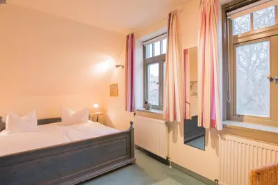 Ein Bett oder Betten in einem Zimmer der Unterkunft Ferienhaussiedlung Strandperlen Sanddornhof 8a (Typ VII)