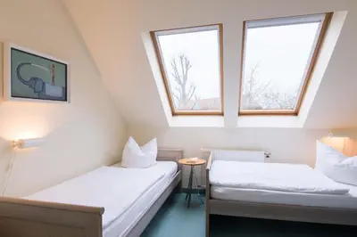 Ein Bett oder Betten in einem Zimmer der Unterkunft Ferienhaussiedlung Strandperlen Sanddornhof 8a (Typ VII)