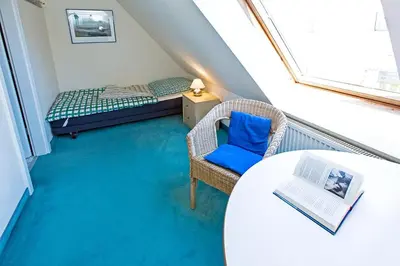 Ein Bett oder Betten in einem Zimmer der Unterkunft Ferienhaussiedlung Strandperlen Sanddornhof 2c (Typ II)