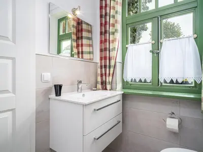 Ein Badezimmer in der Unterkunft Ferienhaussiedlung Strandperlen Sanddornhof 3b (Typ VI)