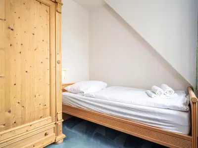 Ein Bett oder Betten in einem Zimmer der Unterkunft Ferienhaussiedlung Strandperlen Sanddornhof 3b (Typ VI)