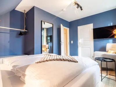 Ein Bett oder Betten in einem Zimmer der Unterkunft Ferienhaussiedlung Strandperlen Küstenhof 4b (Typ IX)