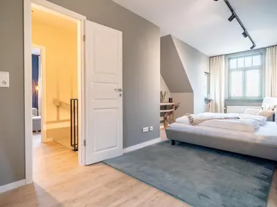 Ein Bett oder Betten in einem Zimmer der Unterkunft Ferienhaussiedlung Strandperlen Küstenhof 4b (Typ IX)